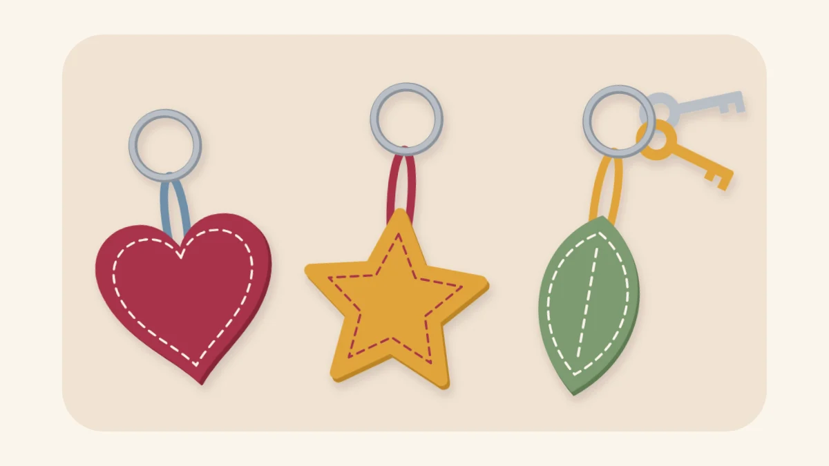 Three stuffed felt keychains, a heart, a star and a leaf, on split rings