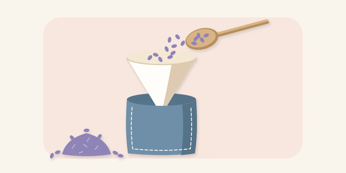 Paper funnel guiding dried lavender from a spoon into an open fabric sachet