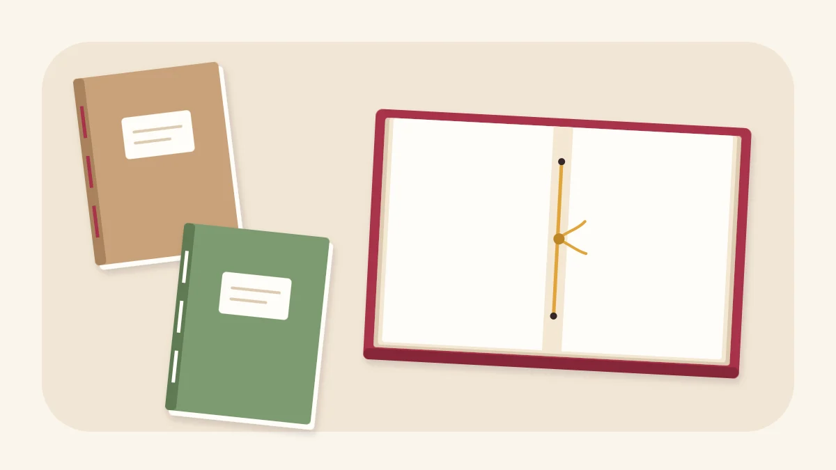Three hand-bound mini notebooks, one open to show the thread along the centre fold