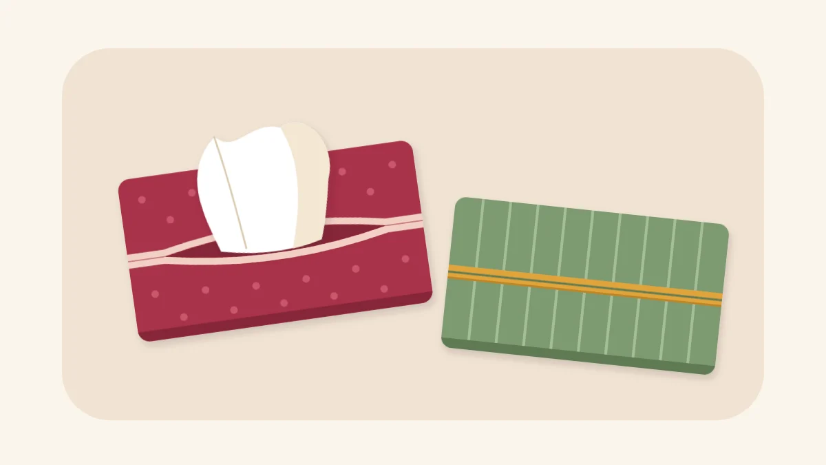 Two fabric pocket tissue holders, one with a tissue pulled through the centre opening