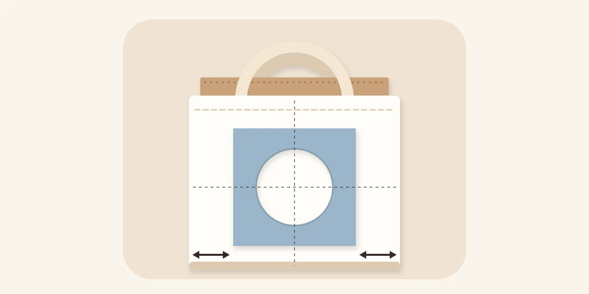 Tote bag with cardboard inside and a paper stencil centred on the front